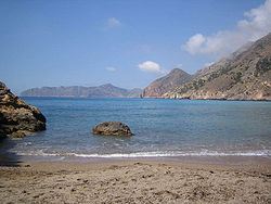 El Portus beach, sheltered rocky cove with character, within the Cartagena municipality